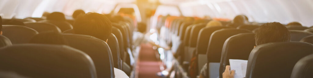 aisle of a plane with seats either side